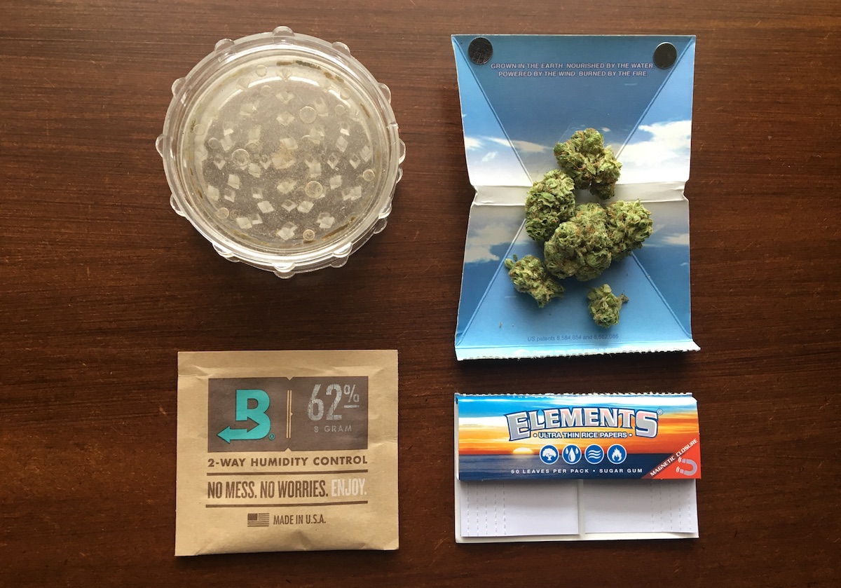 https://theounce.ca/wp-content/uploads/2019/02/Smoking-cannabis-accessories-boveda-grinder-cali-crucher-rollies-rolling-papers-zigzag-elements-luxe.jpg