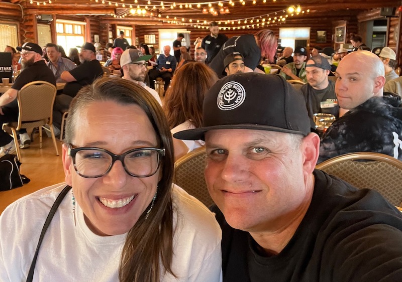 Bradie Sparrow sits with her husband Matt in 100-year-old Pioneer Cabin