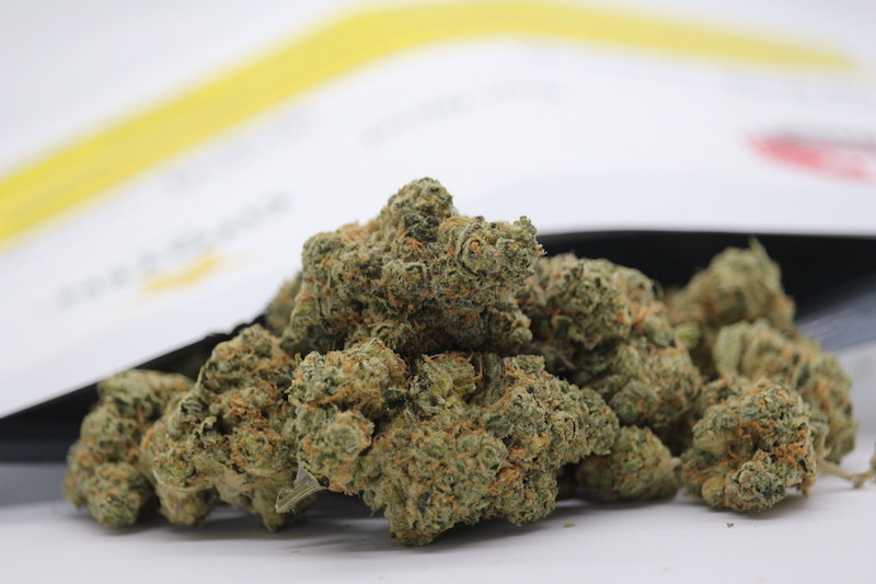 Citoyen Sour Diesel buds are pictured coming out of the packaging