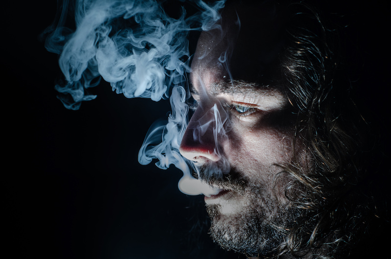Man vaping. A drug called Spice, the zombie drug, has caused people to be compared to zombis
